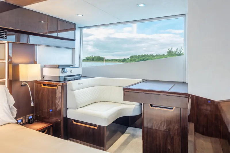 Infinity Yacht Photos Pics Luxurious interior of 2020 Galeon 500 Fly yacht with elegant seating and scenic window view.