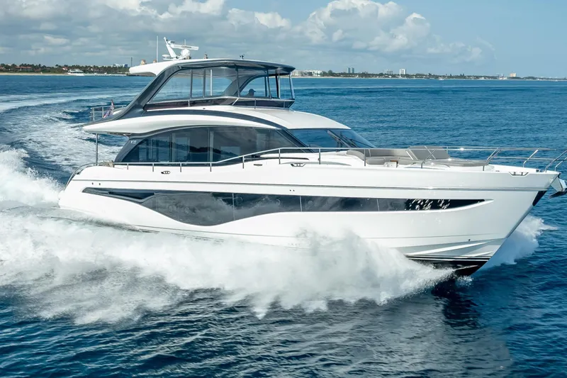 Iseablu Yacht Photos Pics Luxury 2023 Princess Y72 yacht cruising on open sea under clear skies.