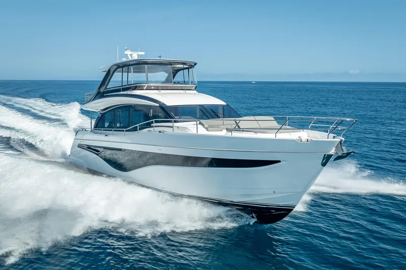 Iseablu Yacht Photos Pics Luxury 2023 Princess Y72 yacht cruising on open sea under clear blue sky.