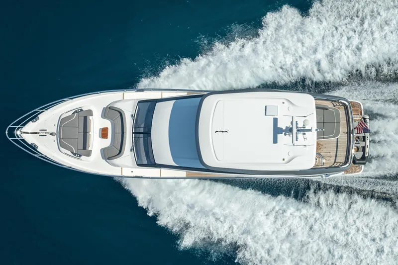 Iseablu Yacht Photos Pics Overhead view of 2023 Princess Y72 yacht cruising on blue ocean waters.