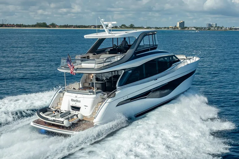 Iseablu Yacht Photos Pics Luxury 2023 Princess Y72 yacht cruising on open water, showcasing sleek design and elegance.