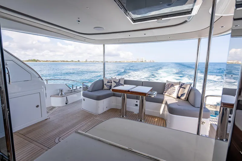 Iseablu Yacht Photos Pics Luxurious 2023 Princess Y72 yacht interior with ocean view and elegant seating area.