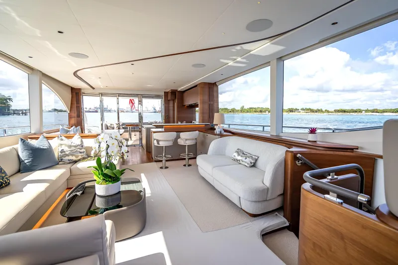 Iseablu Yacht Photos Pics Luxurious interior of 2023 Princess Y72 yacht with elegant seating and panoramic windows.