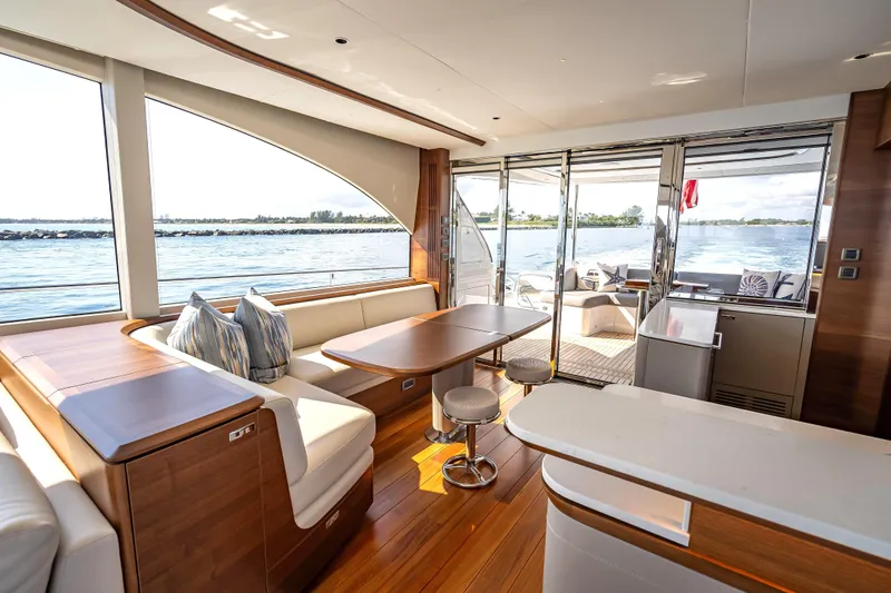 Iseablu Yacht Photos Pics Luxurious interior of 2023 Princess Y72 yacht with elegant seating and ocean view.