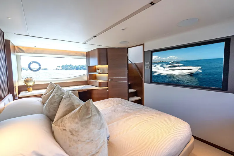 Iseablu Yacht Photos Pics Luxurious interior of 2023 Princess Y72 yacht with elegant bedroom and ocean view.