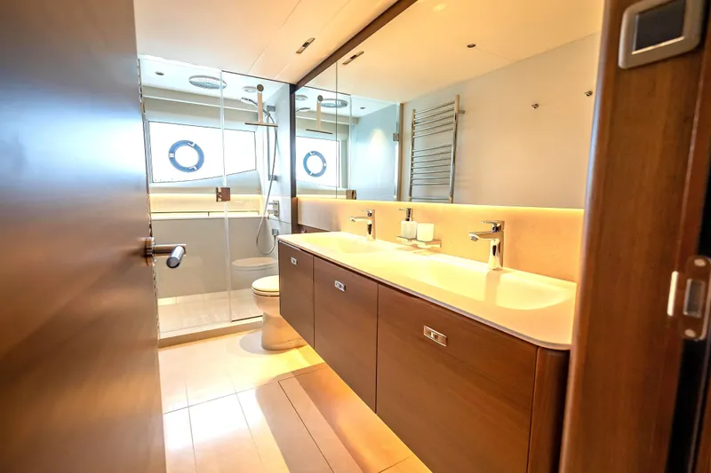 Iseablu Yacht Photos Pics Luxurious bathroom in 2023 Princess Y72 yacht with dual sinks and modern fixtures.