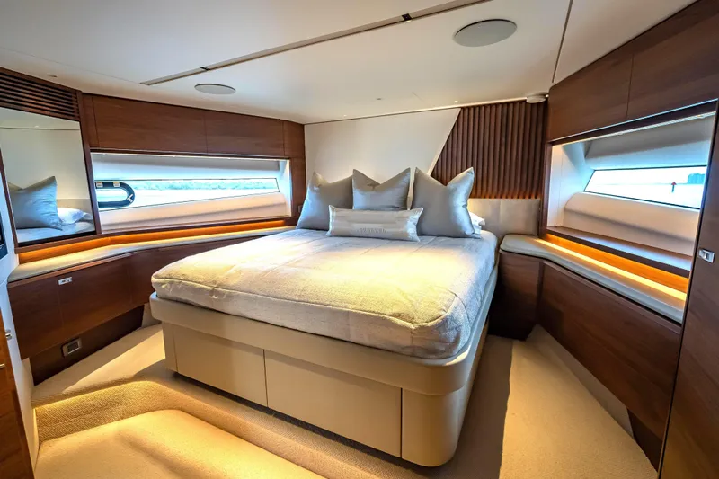 Iseablu Yacht Photos Pics Luxurious bedroom interior of 2023 Princess Y72 yacht with modern design and elegant furnishings.