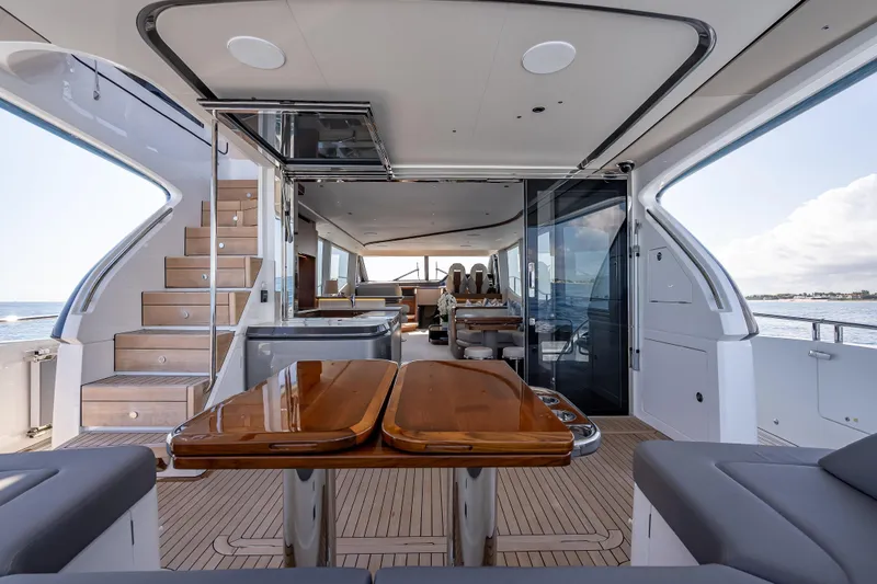 Iseablu Yacht Photos Pics Luxurious 2023 Princess Y72 yacht interior with elegant wood finishes and spacious seating.