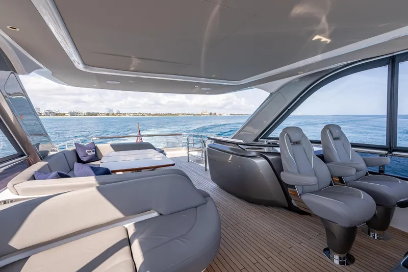Iseablu Yacht Photos Pics Luxurious 2023 Princess Y72 yacht interior with elegant seating and ocean view.