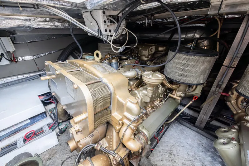 Sea Diva Yacht Photos Pics Engine room of a 1999 Azimut 58 yacht, showcasing detailed mechanical components.