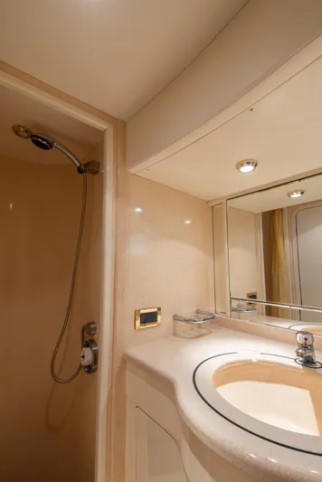 Sea Diva Yacht Photos Pics Luxurious bathroom in 1999 Azimut 58 yacht with shower and elegant sink.