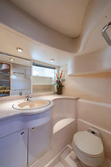 Sea Diva Yacht Photos Pics Luxurious bathroom in 1999 Azimut 58 yacht with modern fixtures and elegant design.