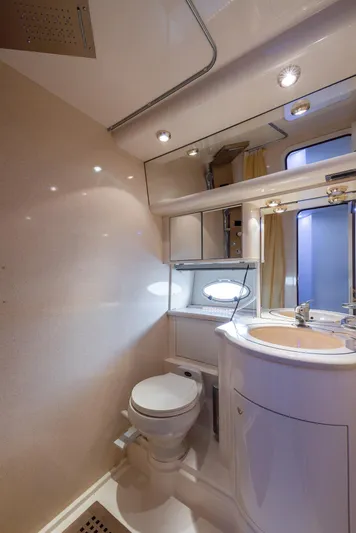 Sea Diva Yacht Photos Pics Luxurious bathroom in a 1999 Azimut 58 yacht, featuring modern fixtures and elegant design.