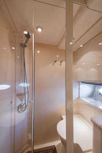 Sea Diva Yacht Photos Pics Luxurious bathroom in 1999 Azimut 58 yacht with modern shower and sleek design.
