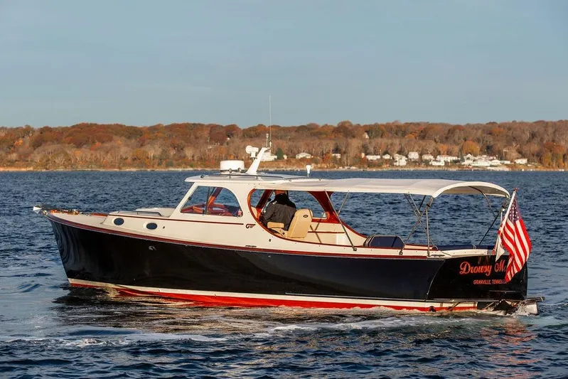 Drowsy Maggie Yacht Photos Pics 2000 Hinckley Picnic Boat Classic cruising on a scenic lake with autumn foliage.