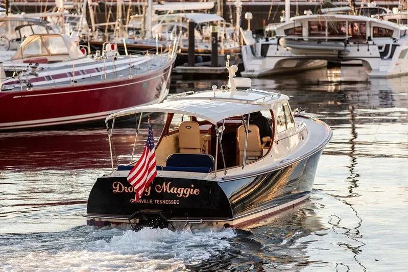 Drowsy Maggie Yacht Photos Pics Hinckley Ya Picn 2001 boat named "Droopy Maggie" in a marina, displaying an American flag.