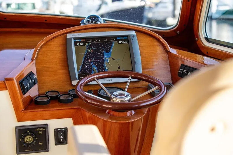 Drowsy Maggie Yacht Photos Pics Hinckley Ya Picn 2001 boat helm with Garmin GPS and wooden steering wheel.