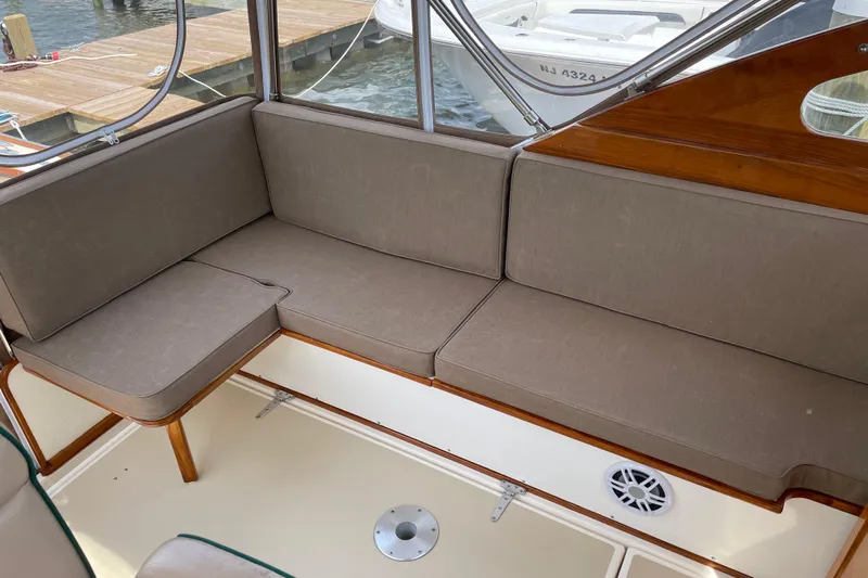 Dulce Yacht Photos Pics Interior seating of 2003 Dyer 29 Soft Top boat with beige cushions.