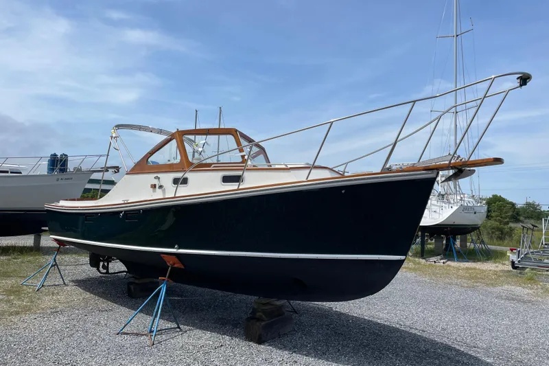 Dulce Yacht Photos Pics 2003 Dyer 29 Soft Top boat on stands, displayed outdoors under a clear sky.
