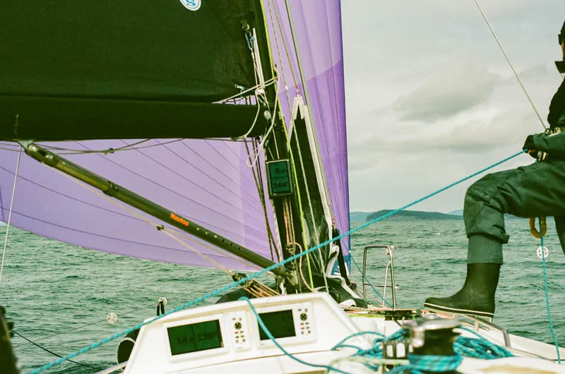 "mah Na Mah Na" Yacht Photos Pics Sailing on a 2020 J Boats J/112E with purple sails and ocean backdrop.