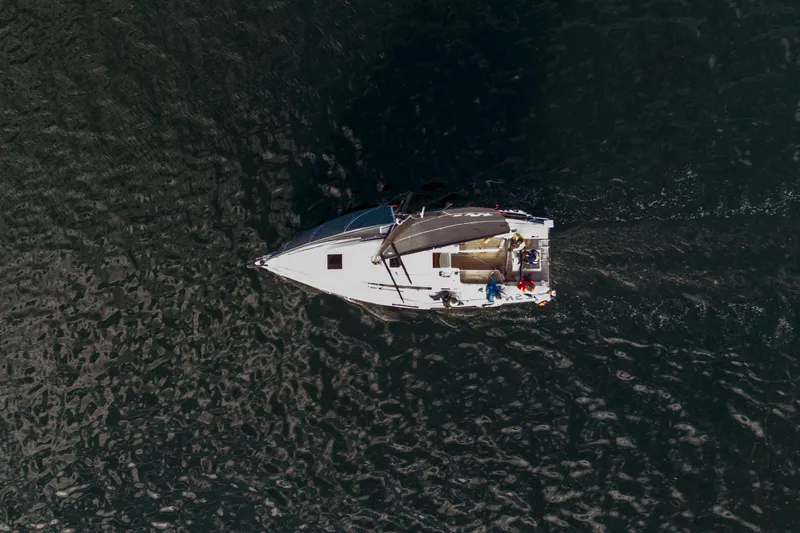 "mah Na Mah Na" Yacht Photos Pics Aerial view of 2020 J Boats J/112E sailing on dark water.