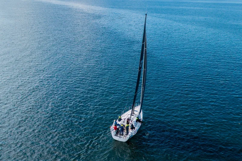 "mah Na Mah Na" Yacht Photos Pics Aerial view of 2020 J Boats J/112E sailing on open water.