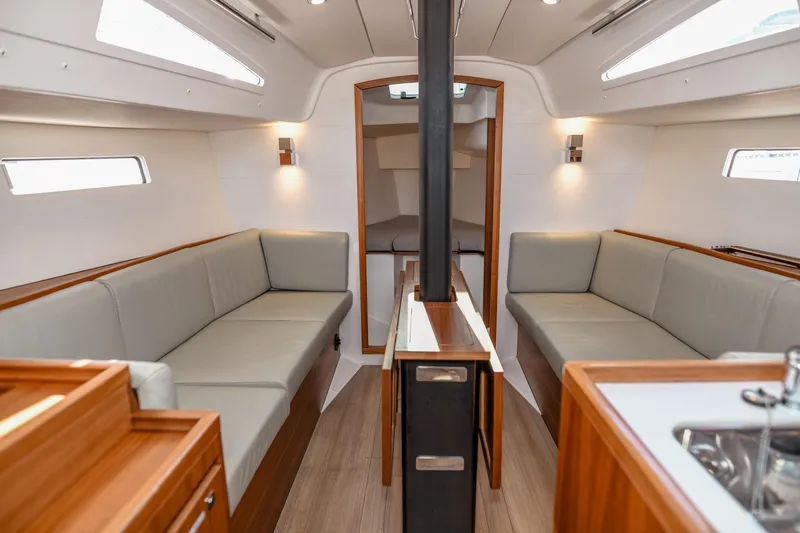 "mah Na Mah Na" Yacht Photos Pics Interior of 2020 J Boats J/112E sailboat with modern seating and wood accents.
