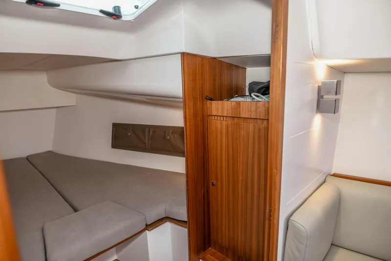 "mah Na Mah Na" Yacht Photos Pics 2020 J Boats J/112E interior cabin with wooden cabinetry and cozy seating area.