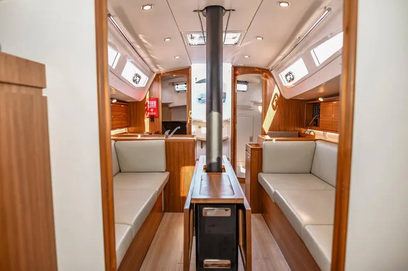 "mah Na Mah Na" Yacht Photos Pics Interior of 2020 J Boats J/112E sailboat, featuring modern wood finish and comfortable seating.