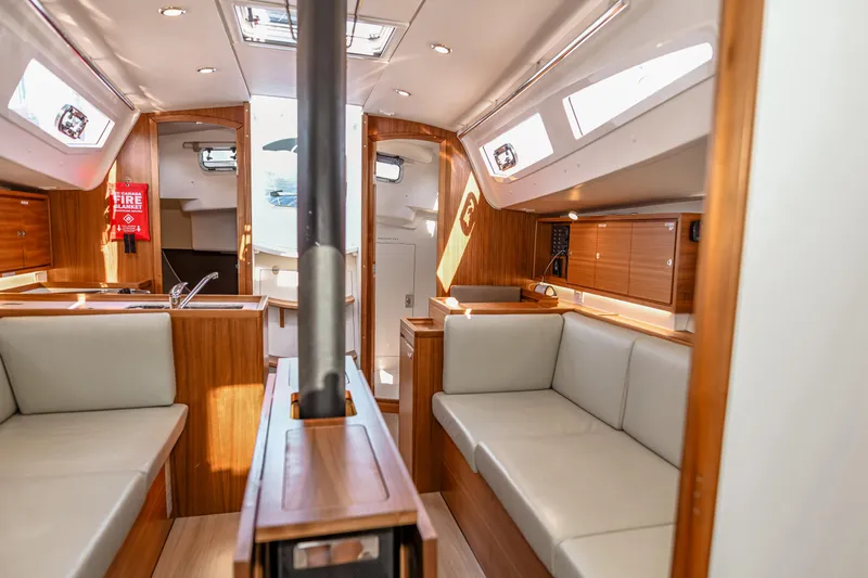 "mah Na Mah Na" Yacht Photos Pics Interior of 2020 J Boats J/112E sailboat with modern wood finish and seating.
