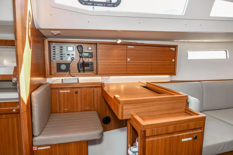 "mah Na Mah Na" Yacht Photos Pics 2020 J Boats J/112E yacht interior with navigation station and wooden cabinetry.