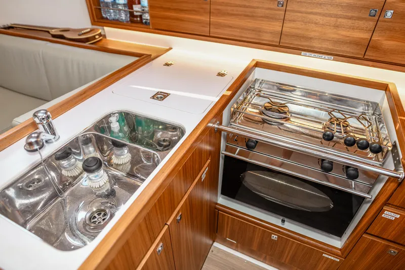 "mah Na Mah Na" Yacht Photos Pics Modern galley kitchen in 2020 J Boats J/112E yacht with sink and stove.