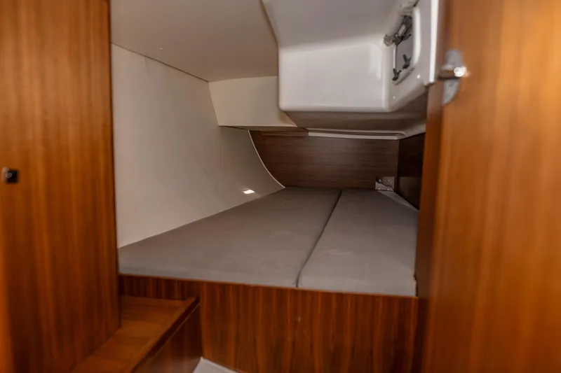 "mah Na Mah Na" Yacht Photos Pics 2020 J Boats J/112E cabin interior with wooden finish and cozy sleeping area.
