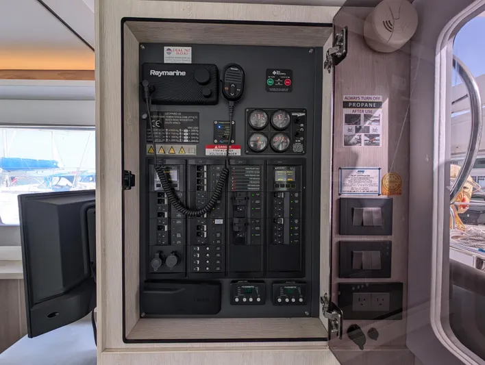 Salty Kiss Yacht Photos Pics Electrical control panel inside a 2020 Leopard 45 catamaran, featuring Raymarine equipment.