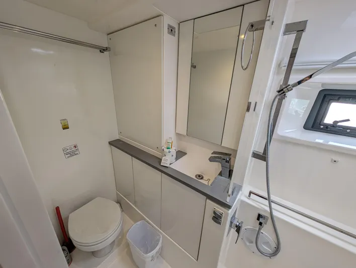 Salty Kiss Yacht Photos Pics Modern bathroom in 2020 Leopard 45 yacht with shower, toilet, and sink.