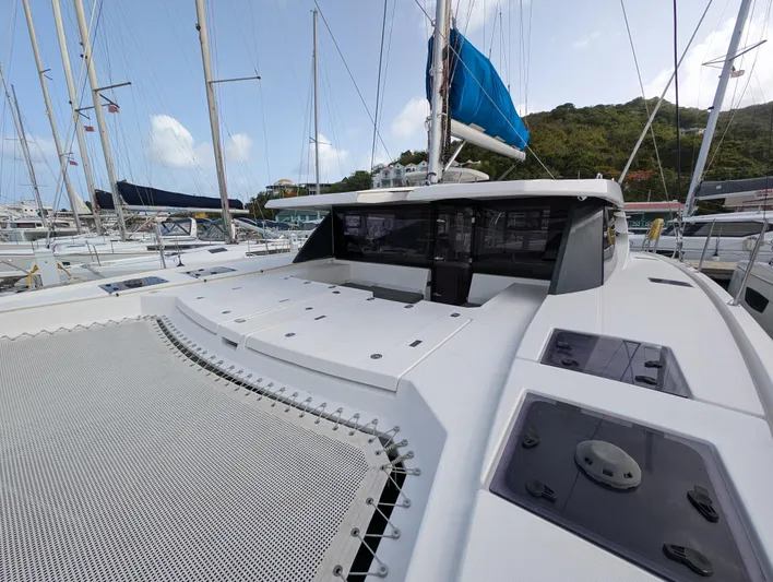 Salty Kiss Yacht Photos Pics 2020 Leopard 45 catamaran docked, featuring spacious deck and modern design.