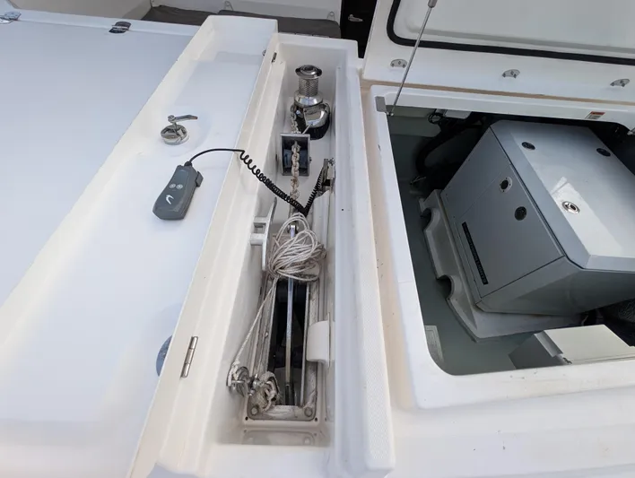 Salty Kiss Yacht Photos Pics Storage compartment on a 2020 Leopard 45 yacht, featuring anchor equipment and control panel.