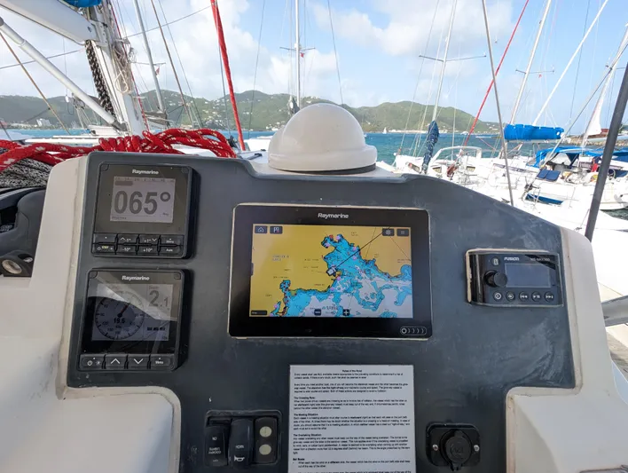 Salty Kiss Yacht Photos Pics Cockpit of 2020 Leopard 45 catamaran with navigation instruments and map display.