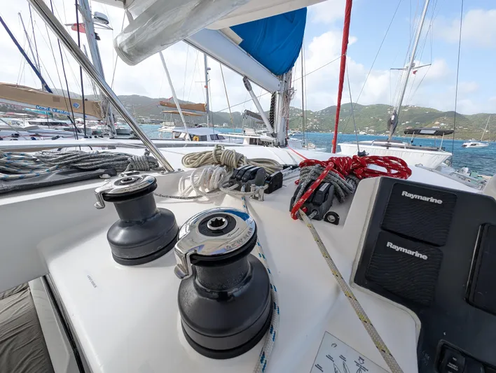 Salty Kiss Yacht Photos Pics Sailing yacht deck with winches and ropes, Leopard 45 model, 2020, in a marina setting.