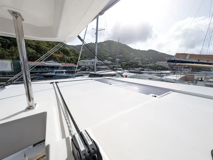 Salty Kiss Yacht Photos Pics Leopard 45 catamaran docked in a scenic marina, 2020 model.