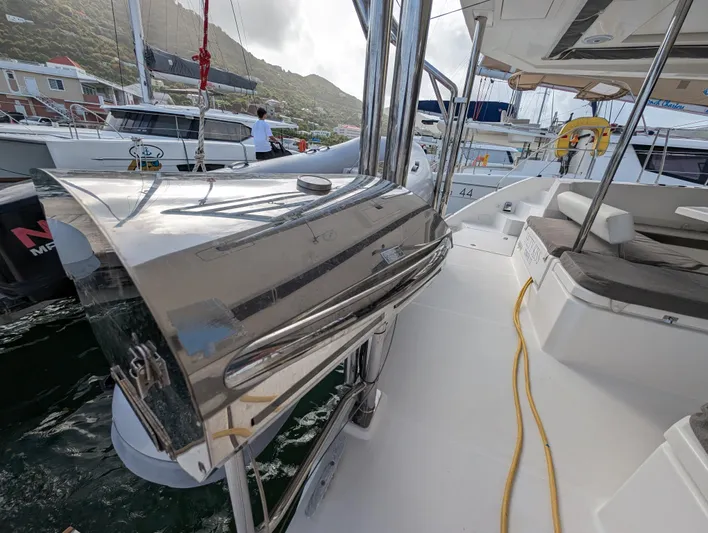 Salty Kiss Yacht Photos Pics Sleek 2020 Leopard 45 yacht with stainless steel grill on deck, docked in marina.