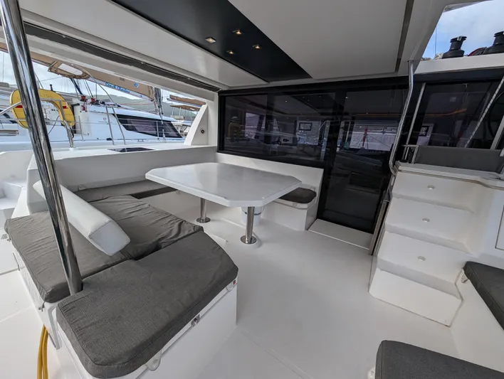 Salty Kiss Yacht Photos Pics Spacious interior of 2020 Leopard 45 catamaran with seating and table.