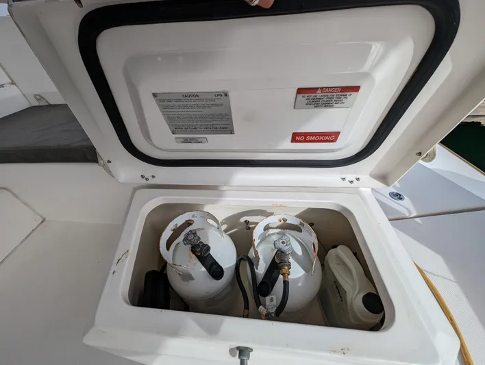 Salty Kiss Yacht Photos Pics Storage compartment with propane tanks on a 2020 Leopard 45 catamaran.