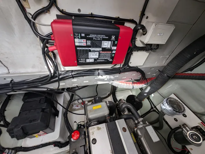 Salty Kiss Yacht Photos Pics Engine room of 2020 Leopard 45 yacht with battery charger and wiring.