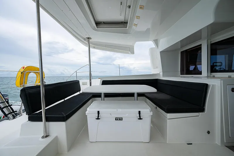 Somewhere Yacht Photos Pics Spacious seating area on 2018 Lagoon 450 catamaran with ocean view.