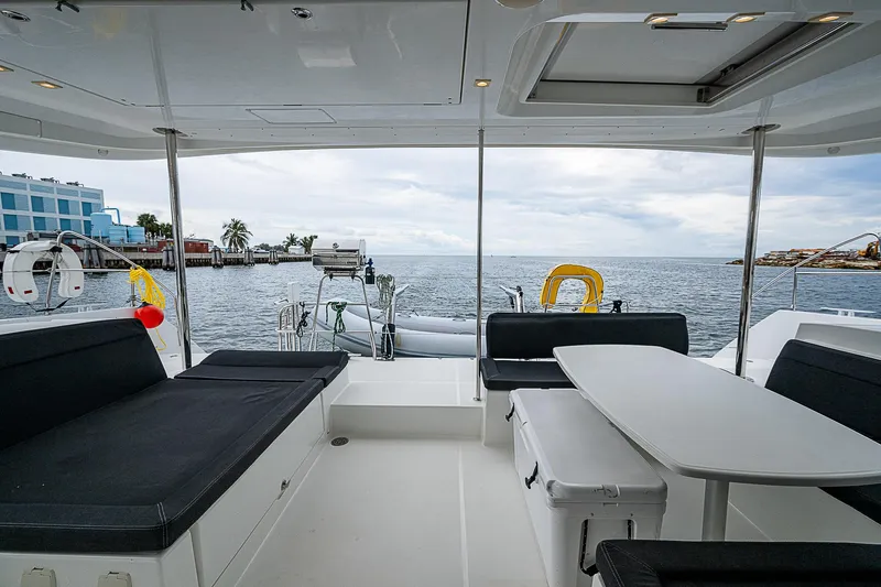 Somewhere Yacht Photos Pics Interior view of 2018 Lagoon 450 catamaran with ocean backdrop.