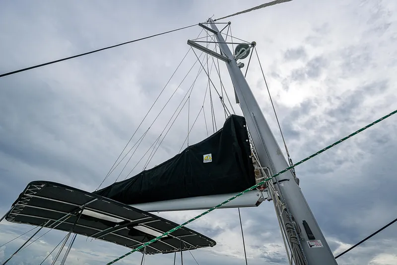 Somewhere Yacht Photos Pics Lagoon 450 sailboat mast and rigging against a cloudy sky, 2018 model.