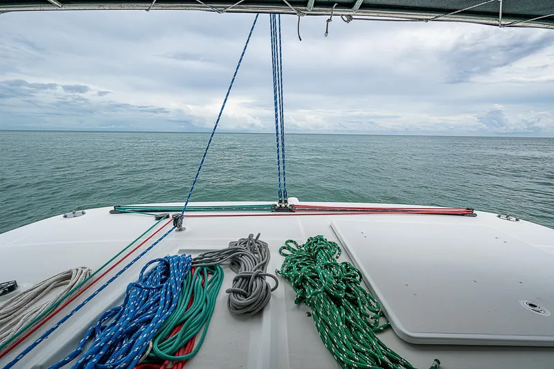 Somewhere Yacht Photos Pics Lagoon 450 catamaran deck with colorful ropes, ocean view, 2018 model.