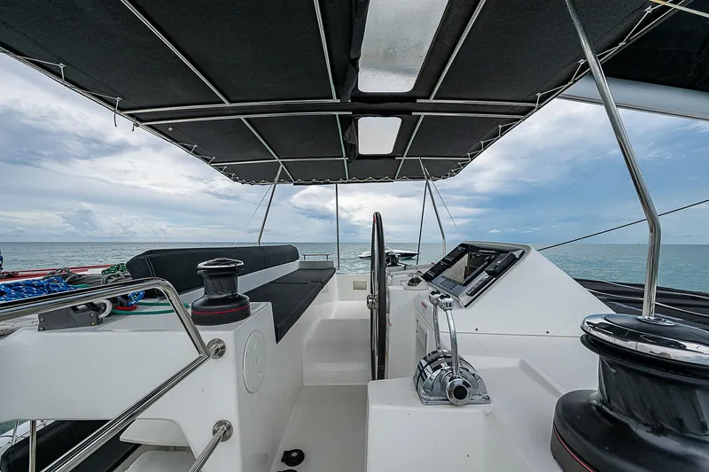 Somewhere Yacht Photos Pics Lagoon 450 catamaran helm, 2018 model, with ocean view and modern controls.