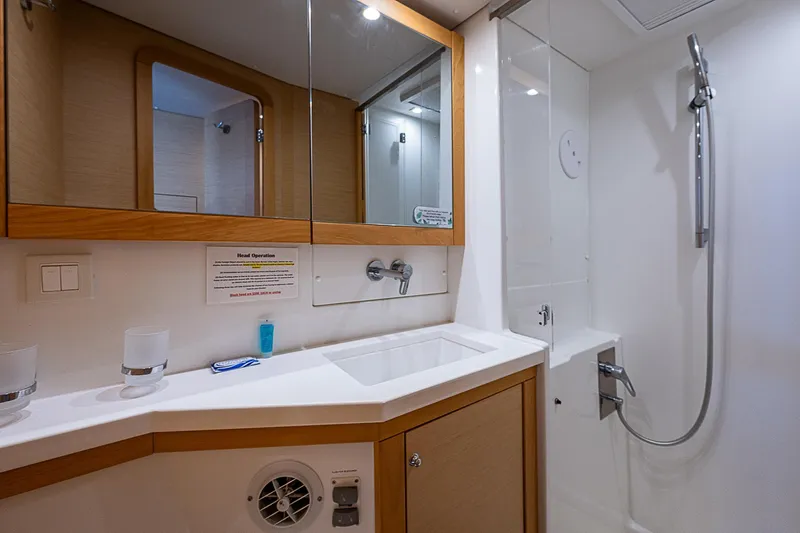 Somewhere Yacht Photos Pics Modern bathroom in 2018 Lagoon 450 yacht with shower and sink.